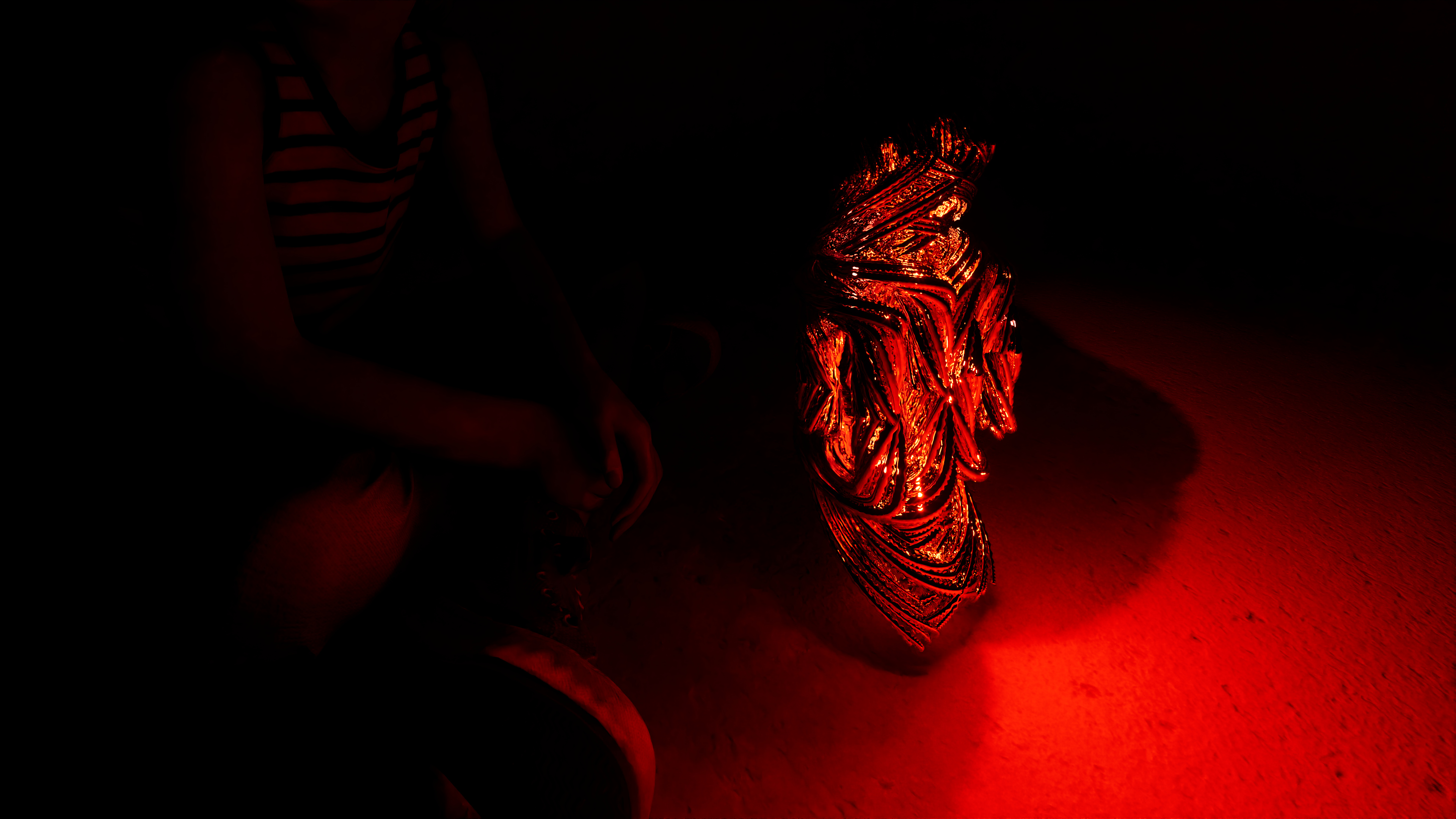 Chrysalis — close view of the glowing form in a red interior